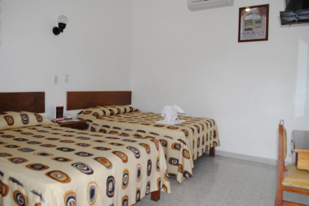 Hotel Arcos Del Parque Акаюкан Номер фото